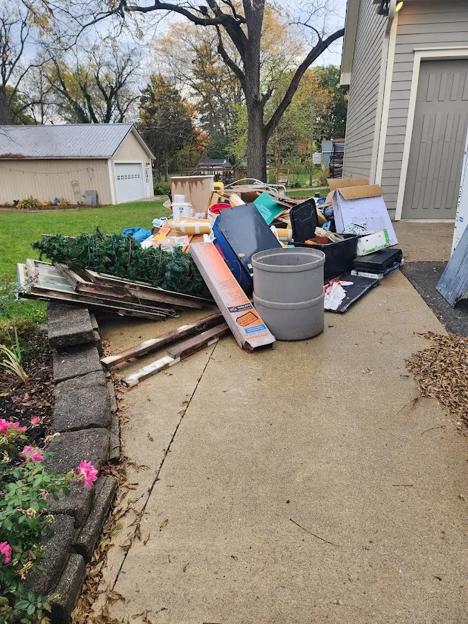 Dumpster being loaded with debris for Commercial Dumpster Rental in Saratoga